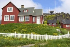 Red houses and church in Greenland.