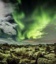 The lava in Iceland is both rough and tender with its soft moss. The aurora among the clouds in the sky shows the beauty of evenings in Iceland.