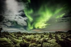 The lava in Iceland is both rough and tender with its soft moss. The aurora among the clouds in the sky shows the beauty of evenings in Iceland.