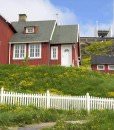 Red houses and church in Greenland.