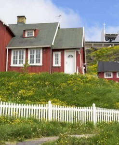 Red houses and church in Greenland.