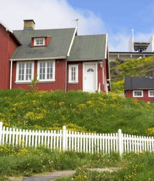 Red houses and church in Greenland.