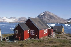 Icebergs and houses in Kulusuk, Greenland.