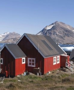 Icebergs and houses in Kulusuk, Greenland.